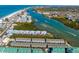 Scenic aerial view of the property with nearby waterfront, and well-manicured grounds at 19823 Gulf Blvd # 33, Indian Shores, FL 33785