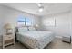Comfortable bedroom featuring large window and bed with patterned quilt at 19823 Gulf Blvd # 33, Indian Shores, FL 33785