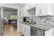 This beautifully updated kitchen features stainless steel appliances and granite countertops at 19823 Gulf Blvd # 33, Indian Shores, FL 33785