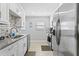 Updated kitchen with stainless appliances, granite countertops, and ample cabinet space at 19823 Gulf Blvd # 33, Indian Shores, FL 33785