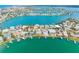 An aerial view of a waterfront community and harbor at 203 Bath Club N Blvd, North Redington Beach, FL 33708