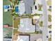 An aerial view of the property shows a waterfront home with a boat dock, pool, and stylish landscaping at 203 Bath Club N Blvd, North Redington Beach, FL 33708