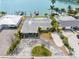 Aerial view of property, dock, and boat lift on a waterfront lot at 203 Bath Club N Blvd, North Redington Beach, FL 33708