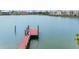 A small red dock at the back of a waterfront lot at 203 Bath Club N Blvd, North Redington Beach, FL 33708