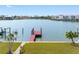 Waterfront view with a private dock and room to dock your boat and enjoy outdoor waterfront living at 203 Bath Club N Blvd, North Redington Beach, FL 33708