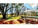 Serene backyard featuring a screened-in pool area and lush greenery, perfect for relaxation and outdoor enjoyment at 210 Lake Hobbs Rd, Lutz, FL 33548