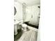 Beautiful bathroom with tiled shower, stone shower floor, and pedestal sink at 210 Lake Hobbs Rd, Lutz, FL 33548