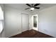 Cozy bedroom with hardwood floors, closet, and window provides a relaxing atmosphere at 210 Lake Hobbs Rd, Lutz, FL 33548