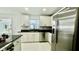 Kitchen featuring granite countertops, stainless steel appliances, and ample storage at 210 Lake Hobbs Rd, Lutz, FL 33548
