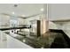 Modern kitchen with granite countertops, stainless steel appliances, and white cabinets at 210 Lake Hobbs Rd, Lutz, FL 33548