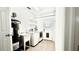 Functional laundry room with washer, dryer, utility sink, and convenient shelving at 210 Lake Hobbs Rd, Lutz, FL 33548