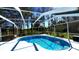 Inviting screened-in pool with refreshing blue water and ample space for relaxation and enjoyment at 210 Lake Hobbs Rd, Lutz, FL 33548