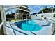 Inviting screened-in pool with refreshing blue water and ample space for relaxation and enjoyment at 210 Lake Hobbs Rd, Lutz, FL 33548