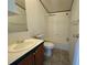 Bright bathroom with a vanity, toilet, and a shower-over-tub combination at 215 S Port Royal Ln, Apollo Beach, FL 33572