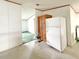 Spacious pantry area with ample storage space and a view into the living area at 215 S Port Royal Ln, Apollo Beach, FL 33572