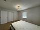 Bedroom with neutral walls, closet and modern lighting at 21838 Edgewater Dr, Port Charlotte, FL 33952