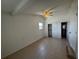 This bedroom features an ensuite bathroom and sliding closet doors, as well as tile floors at 21838 Edgewater Dr, Port Charlotte, FL 33952