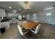 Open-concept kitchen and dining area featuring a large island, white appliances, and modern lighting at 21838 Edgewater Dr, Port Charlotte, FL 33952