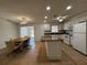 Bright kitchen with granite countertops, an island, white cabinets, and stainless steel appliances at 21838 Edgewater Dr, Port Charlotte, FL 33952