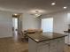 Open kitchen with tile floors and breakfast area at 21838 Edgewater Dr, Port Charlotte, FL 33952