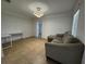 This living room features tile floors, modern lighting, and a couch with a desk nearby at 21838 Edgewater Dr, Port Charlotte, FL 33952