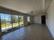 Open living room featuring sliding glass doors with a lovely view at 21838 Edgewater Dr, Port Charlotte, FL 33952