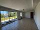 Open living room featuring sliding glass doors with a lovely view at 21838 Edgewater Dr, Port Charlotte, FL 33952