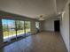 Open living room featuring sliding glass doors with a lovely view at 21838 Edgewater Dr, Port Charlotte, FL 33952
