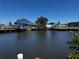 Scenic waterfront view of a house with boat docks at 21838 Edgewater Dr, Port Charlotte, FL 33952