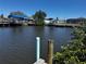 This picturesque waterfront view shows the canal, boat docks, and nearby homes at 21838 Edgewater Dr, Port Charlotte, FL 33952