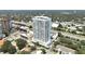 Luxury condominium with rooftop pool and amenities, showcasing the building's design, landscaping, and its place in the city skyline at 2910 W Barcelona St # 403, Tampa, FL 33629