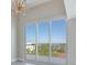 Balcony with glass railings offering stunning waterfront views from this luxurious residence at 2910 W Barcelona St # 403, Tampa, FL 33629