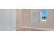 Bright bedroom featuring tile floor, window view and door at 2910 W Barcelona St # 403, Tampa, FL 33629