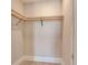 Walk-in closet features custom wooden shelving and tile floors at 2910 W Barcelona St # 403, Tampa, FL 33629