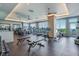 Gym with modern equipment and large windows overlooking the water at 2910 W Barcelona St # 403, Tampa, FL 33629