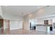 Open kitchen and living space with tiled floors, modern lighting, stainless appliances, and wine cooler at 2910 W Barcelona St # 403, Tampa, FL 33629