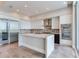 Bright kitchen with stainless appliances, wine cooler, island, and tiled floor at 2910 W Barcelona St # 403, Tampa, FL 33629
