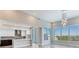 Modern kitchen features stainless steel appliances, white cabinets, and an island, plus lovely water views at 2910 W Barcelona St # 403, Tampa, FL 33629