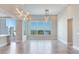 Bright and spacious living room with modern lighting fixtures and a stunning scenic view at 2910 W Barcelona St # 403, Tampa, FL 33629