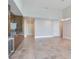 Bright living room with wine cooler and storage, tiled floors, and modern light fixture at 2910 W Barcelona St # 403, Tampa, FL 33629