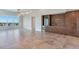 Spacious living room with scenic view, tiled floors, wine cooler, and a modern bar at 2910 W Barcelona St # 403, Tampa, FL 33629