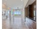 Spacious living room with modern lighting, tile floors, and panoramic views, complete with a service bar at 2910 W Barcelona St # 403, Tampa, FL 33629