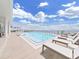 Rooftop pool with clear blue water and lounge chairs at 2910 W Barcelona St # 403, Tampa, FL 33629