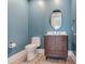 Stylish powder room featuring unique vanity, modern mirror and decorative floor tiles at 2910 W Barcelona St # 403, Tampa, FL 33629
