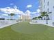 Private rooftop putting green with seating, creating an exclusive outdoor recreational area with elegant design and city views at 2910 W Barcelona St # 403, Tampa, FL 33629