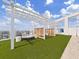 Relaxing rooftop area with a cushioned circular lounge and a stylish pergola at 2910 W Barcelona St # 403, Tampa, FL 33629