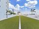 Green rooftop lawn with a grilling area in the background overlooking the cityscape at 2910 W Barcelona St # 403, Tampa, FL 33629