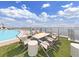 Rooftop with a pool, fire pit, and comfortable seating with city views at 2910 W Barcelona St # 403, Tampa, FL 33629