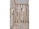 Close-up of tiled shower, featuring neutral tones and modern fixtures for a clean and luxurious experience at 2910 W Barcelona St # 403, Tampa, FL 33629