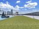 Beautiful rooftop turf area surrounded by a fence, offering space for leisure activities or relaxation with city views at 2910 W Barcelona St # 403, Tampa, FL 33629